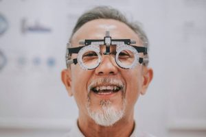 asian chinese senior man patient checking vision in ophthalmological clinic