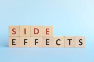 Side effects word on wooden blocks in blue background typography.